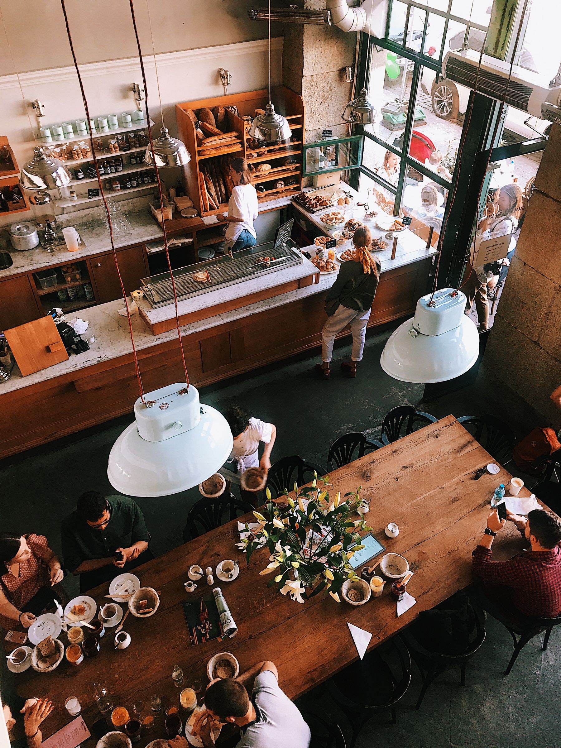 The bakehouse room, wooden tables and morning light.
