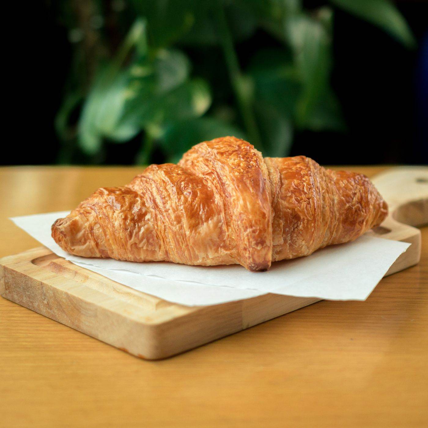 Croissants on a board.